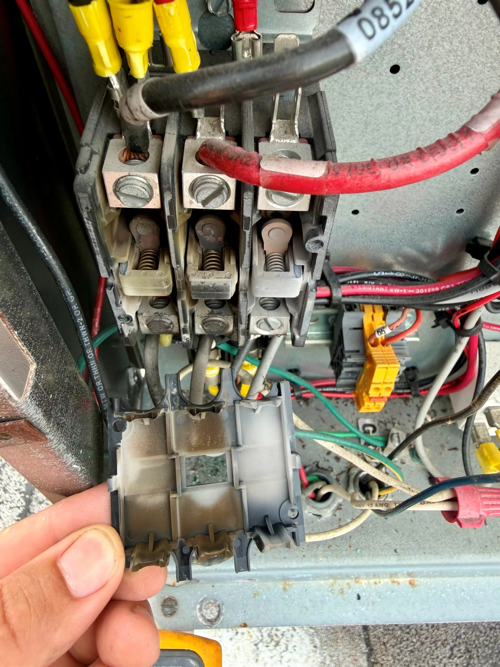 Contactor components inspected during electrical troubleshooting of a Stuart walk-in cooler