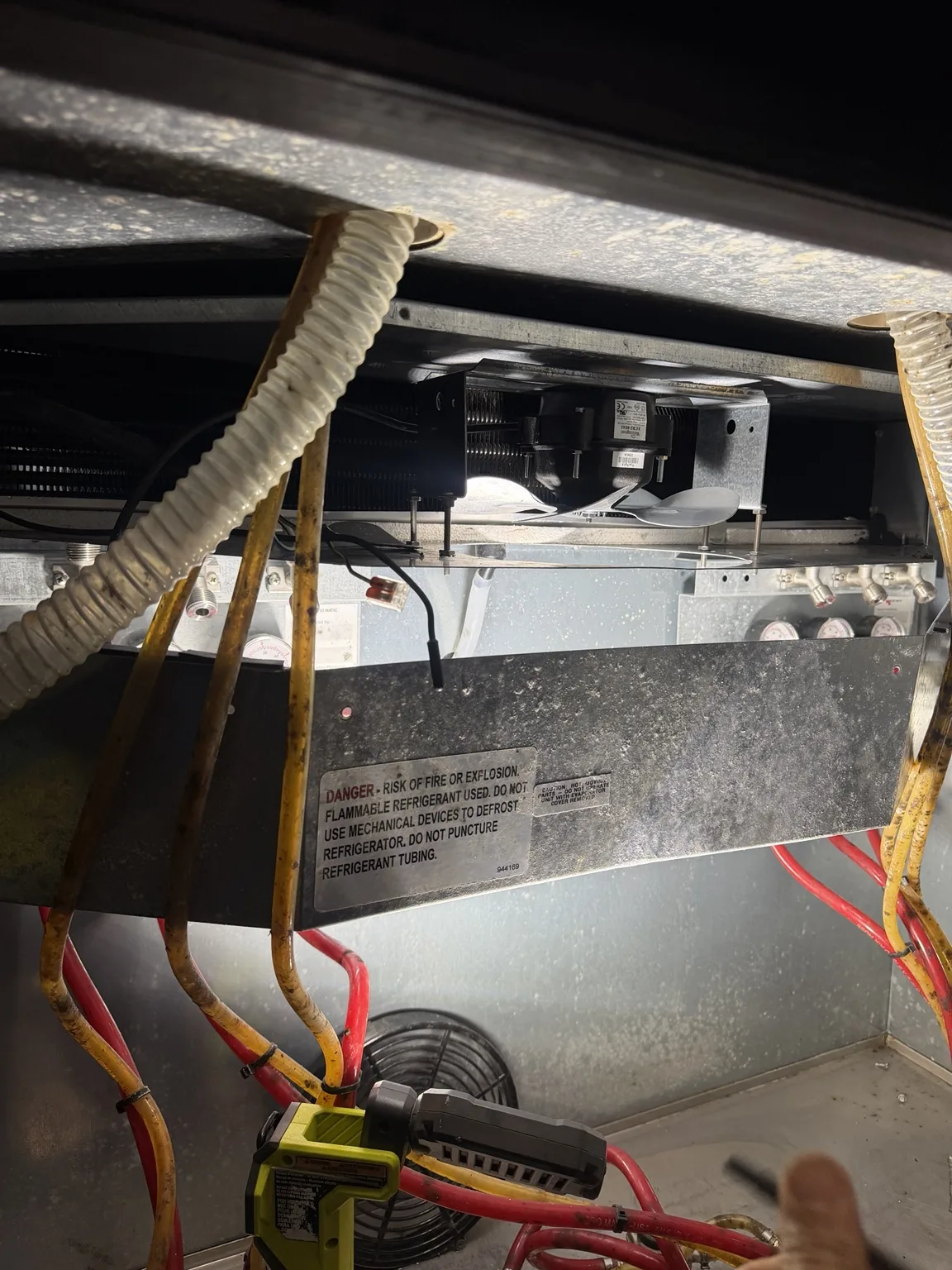 Fan assembly and mounting bracket inside a beer-keg cooler in Jensen Beach