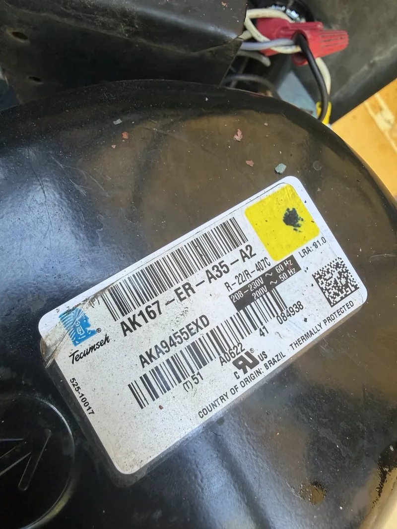 Tecumseh compressor label showing AKA9455EXD and AK167-ER-A35-A2 on the replacement installed at Francesca's Pizza