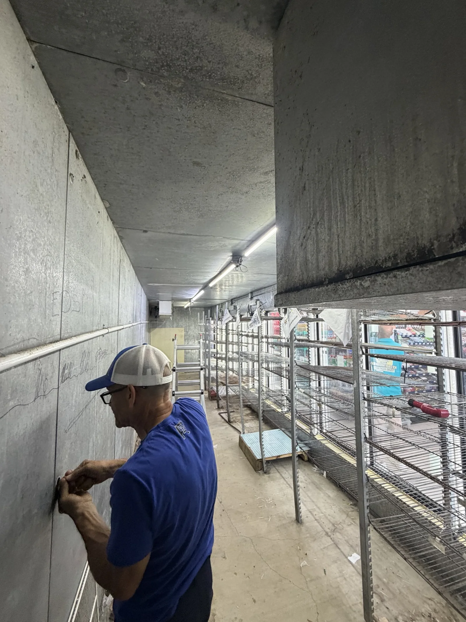 Existing walk-in cooler interior before enclosure replacement in Tequesta