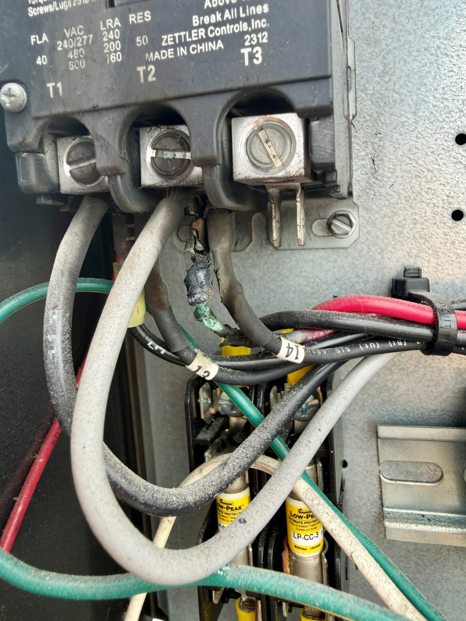 Heat-damaged electrical wiring found during Stuart walk-in cooler diagnosis