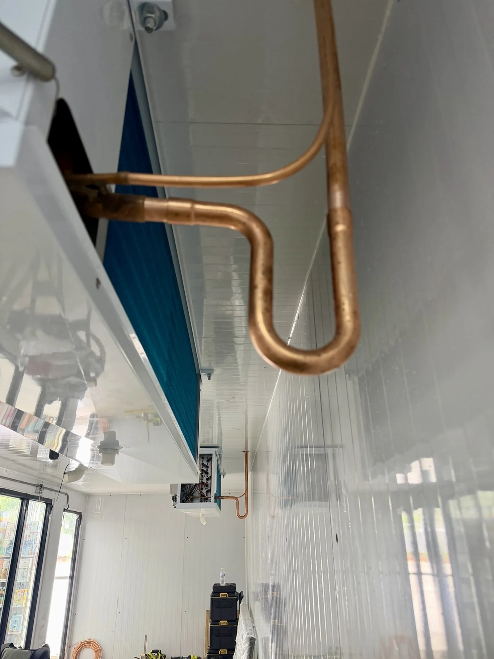 Copper refrigerant piping at the walk-in cooler evaporators