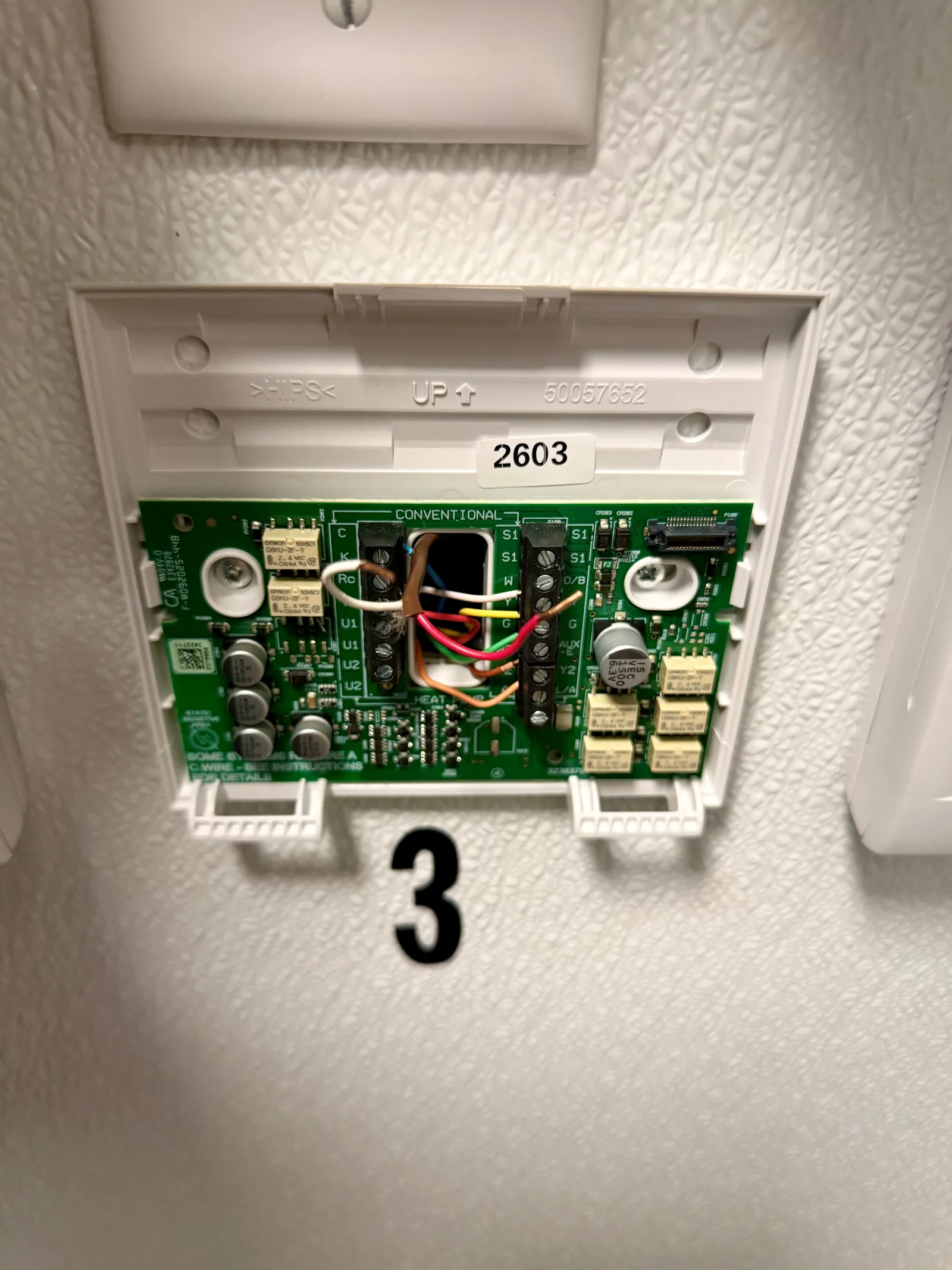 Commercial thermostat conventional wiring with a two-wire remote indoor temperature sensor landed on the S1 and S1 terminals