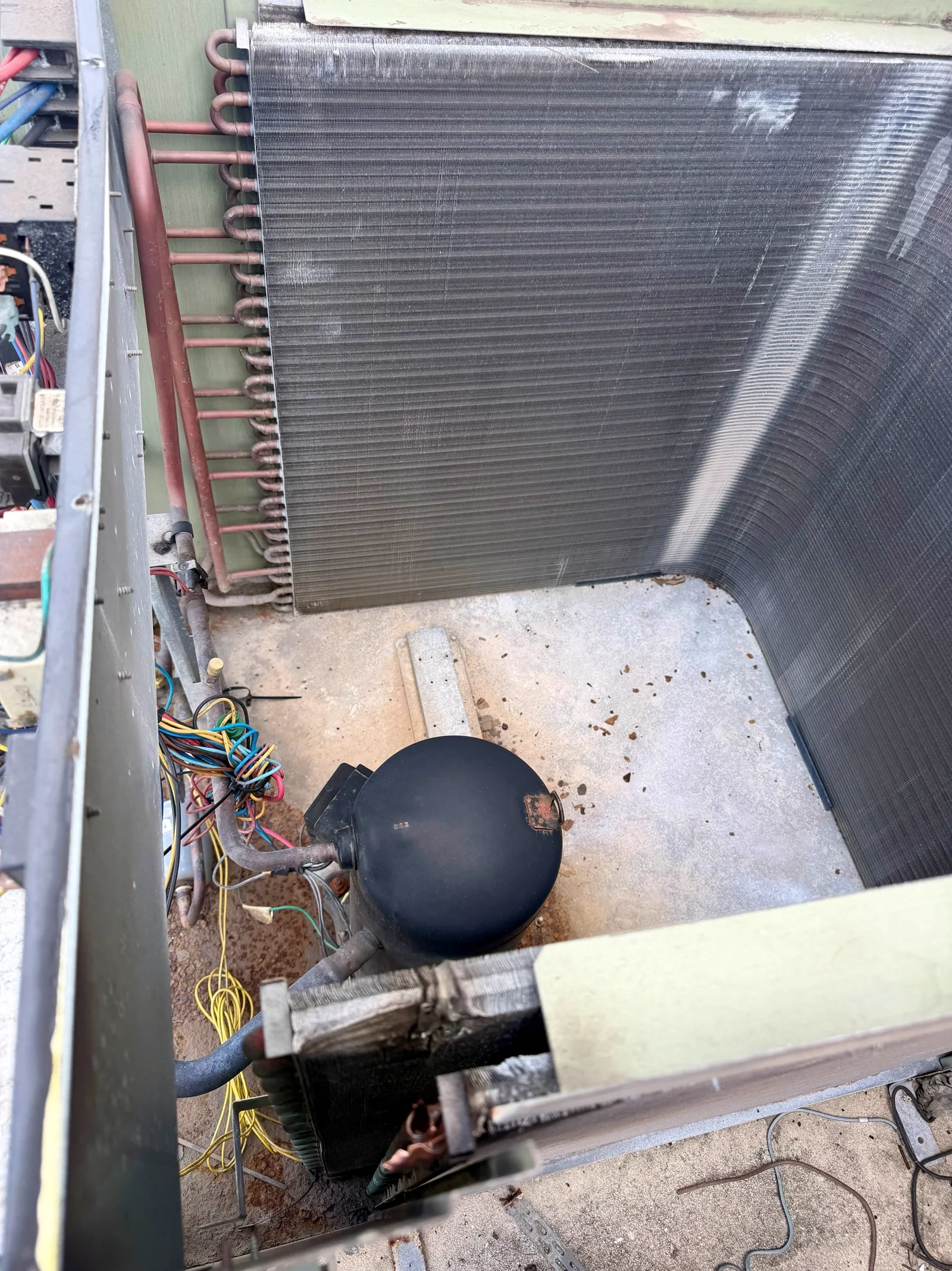 Replacement condenser coil installed inside the Trane condensing unit cabinet in Fort Pierce