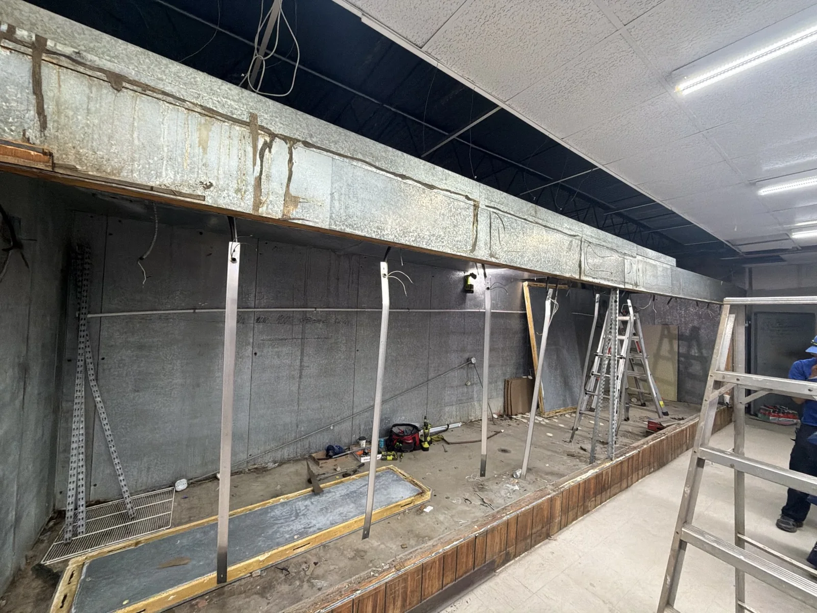 Old walk-in cooler enclosure during demolition