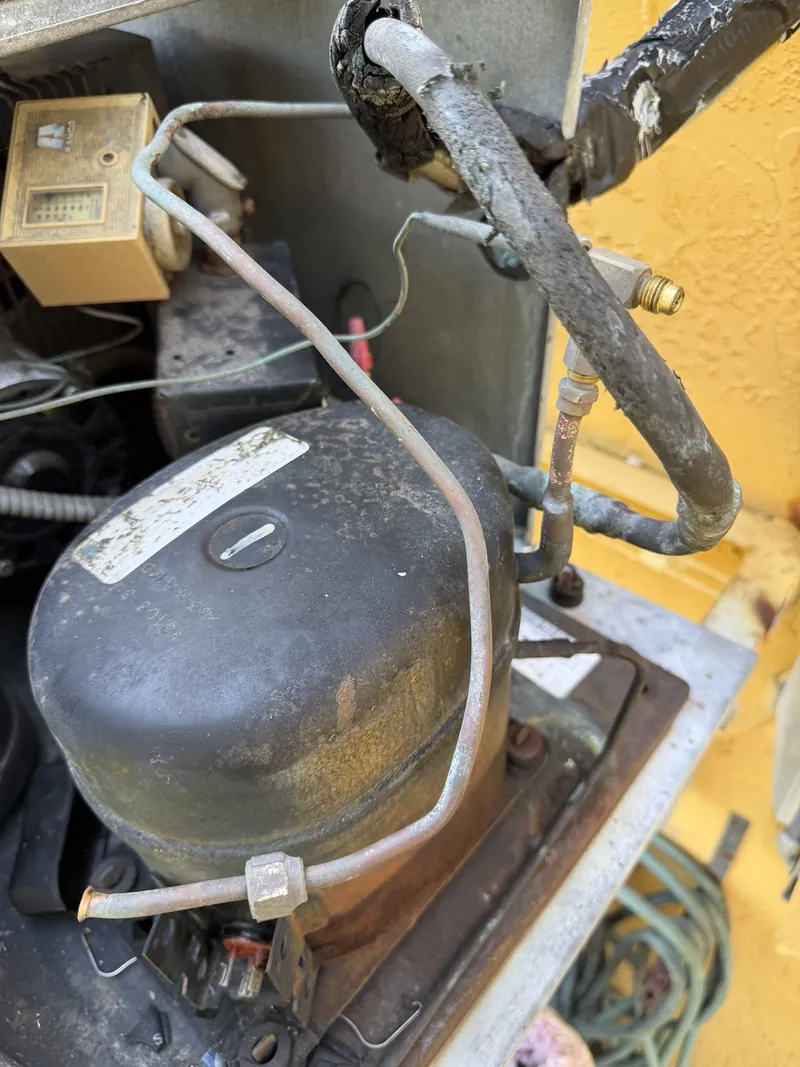 Original locked compressor in the walk-in cooler condensing unit at Francesca's Pizza before replacement